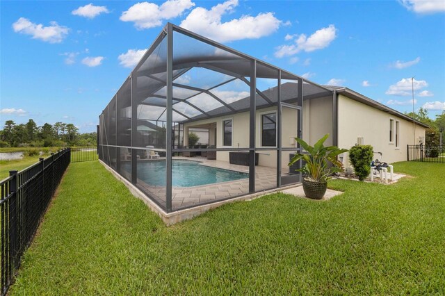 3972 Wisdom Trl, Land O Lakes, FL 34638 - back of house with a patio area, stucco siding, and glass enclosure