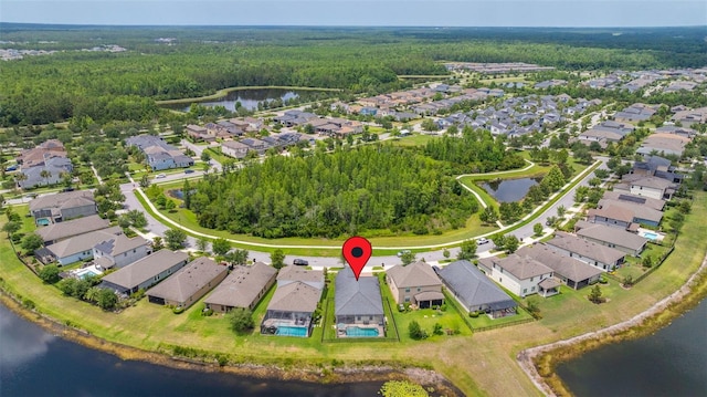 3972 Wisdom Trl, Land O Lakes, FL 34638 - aerial view of residential area with a forest and a large body of water
