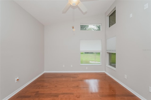 11741 Teapot Ct, Spring Hill, FL 34609 - unfurnished room featuring wood finished floors, a ceiling fan, and baseboards
