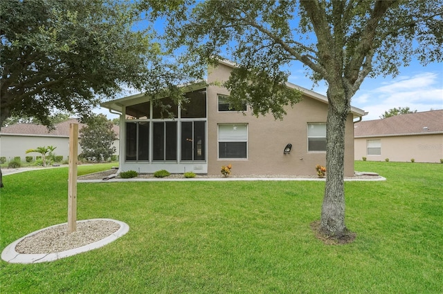 11741 Teapot Ct, Spring Hill, FL 34609 - back of house featuring a yard and stucco siding