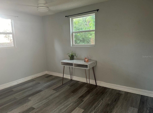 6741 4th Ave N, Saint Petersburg, FL 33710 - empty room with baseboards and dark wood-style floors
