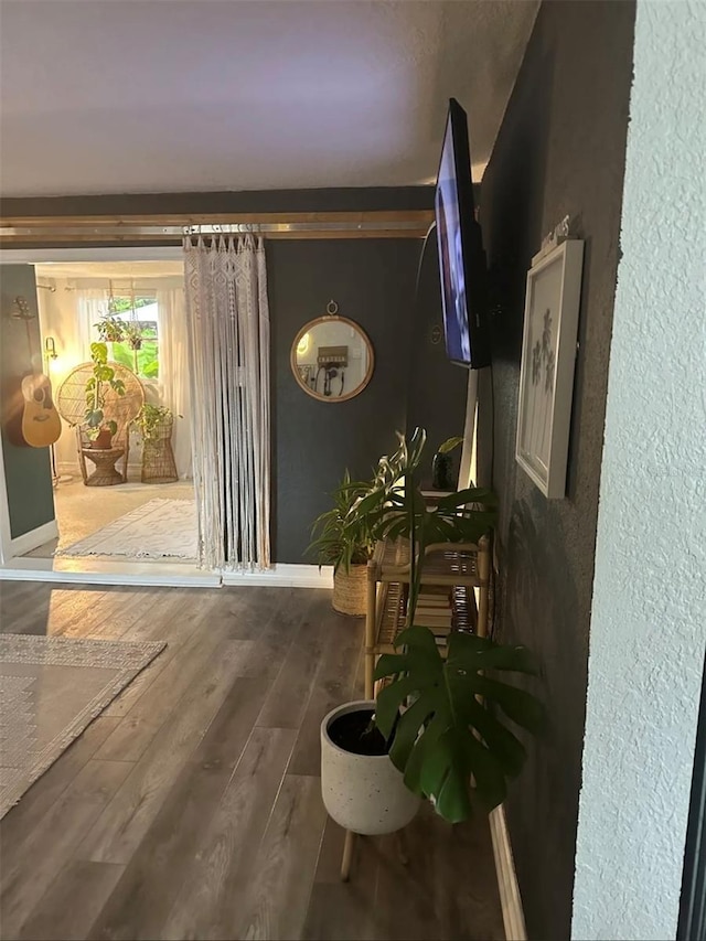 6741 4th Ave N, Saint Petersburg, FL 33710 - corridor with a textured wall, baseboards, and wood finished floors