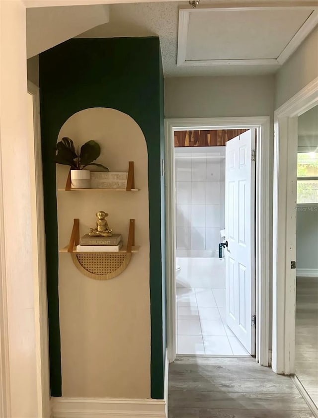 6741 4th Ave N, Saint Petersburg, FL 33710 - hallway featuring wood finished floors and baseboards