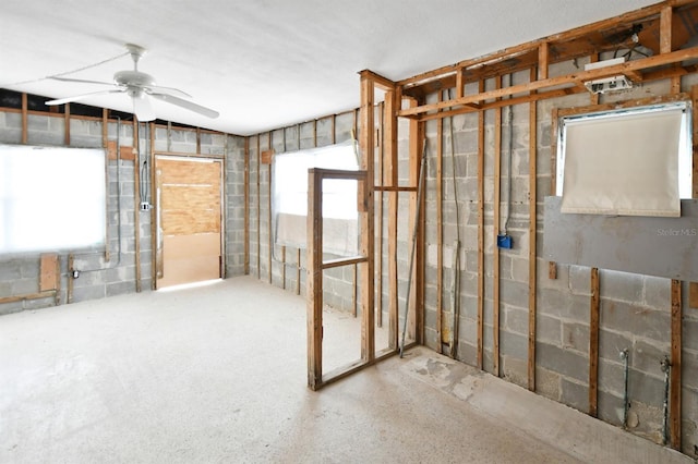 14147 Palm St, Madeira Beach, FL 33708 - below grade area with ceiling fan and plenty of natural light