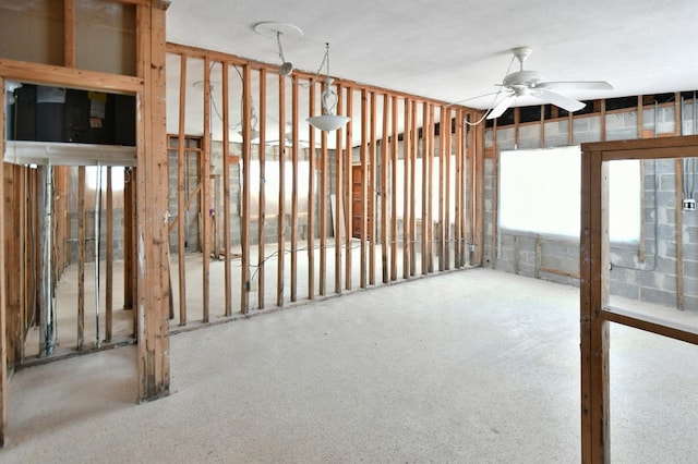 14147 Palm St, Madeira Beach, FL 33708 - below grade area with ceiling fan and plenty of natural light