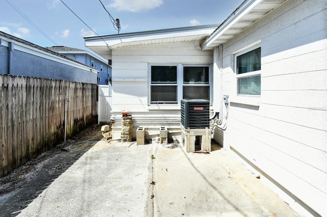14147 Palm St, Madeira Beach, FL 33708 - view of patio / terrace featuring cooling unit
