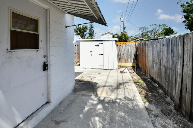14147 Palm St, Madeira Beach, FL 33708 - fenced backyard featuring a patio