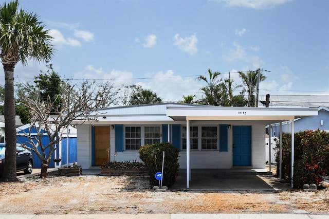 14147 Palm St, Madeira Beach, FL 33708 - view of front facade with a carport