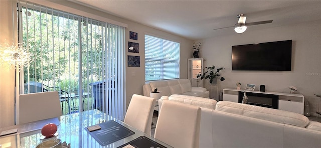 living area featuring a ceiling fan
