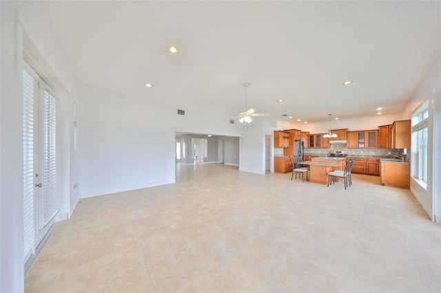 710 116th Ave, Treasure Island, FL 33706 - living area with a ceiling fan, recessed lighting, and light tile patterned floors