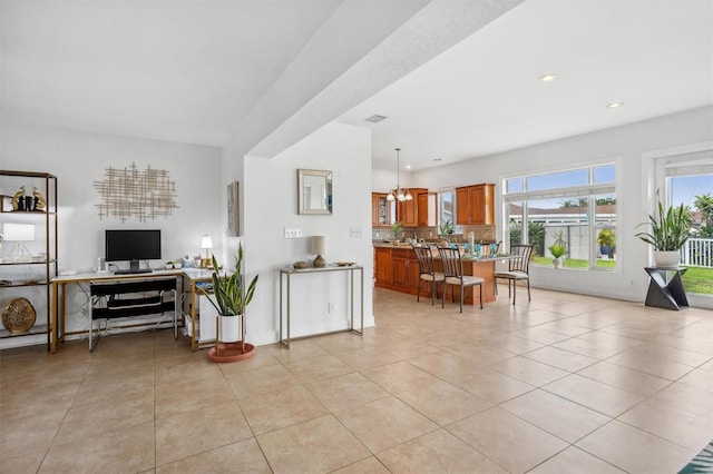 710 116th Ave, Treasure Island, FL 33706 - living area featuring light tile patterned floors, recessed lighting, and an office area