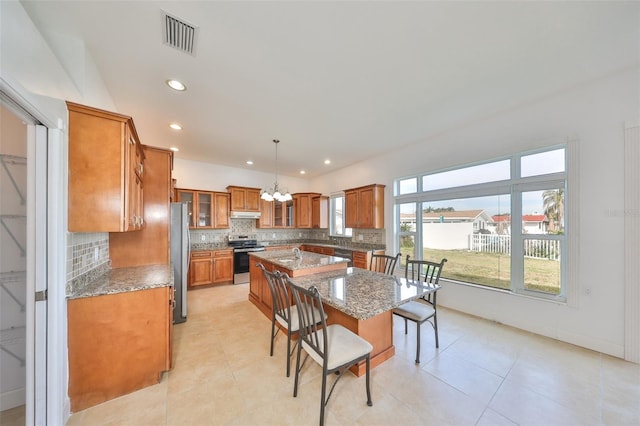 710 116th Ave, Treasure Island, FL 33706 - dining room with a chandelier, recessed lighting, and light tile patterned flooring
