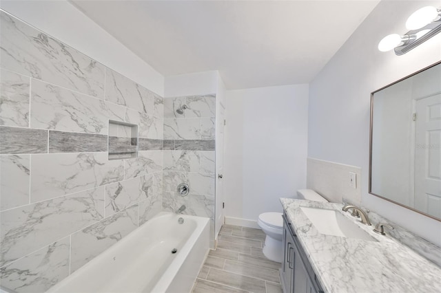 710 116th Ave, Treasure Island, FL 33706 - full bath featuring vanity, toilet, shower / washtub combination, and baseboards