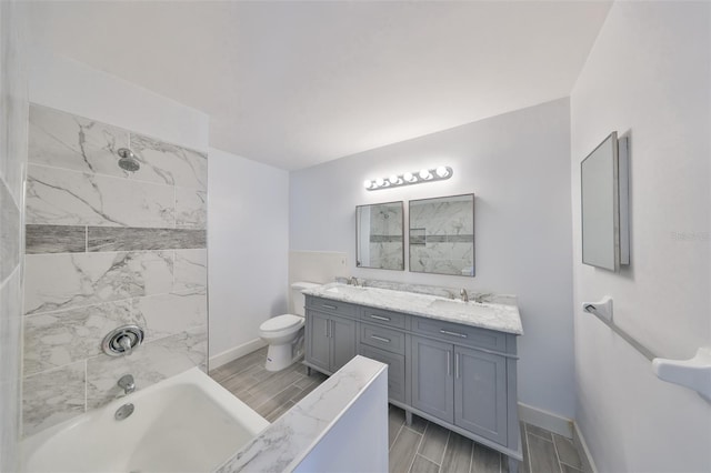 710 116th Ave, Treasure Island, FL 33706 - bathroom with double vanity, toilet, wood tiled floors, and washtub / shower combination