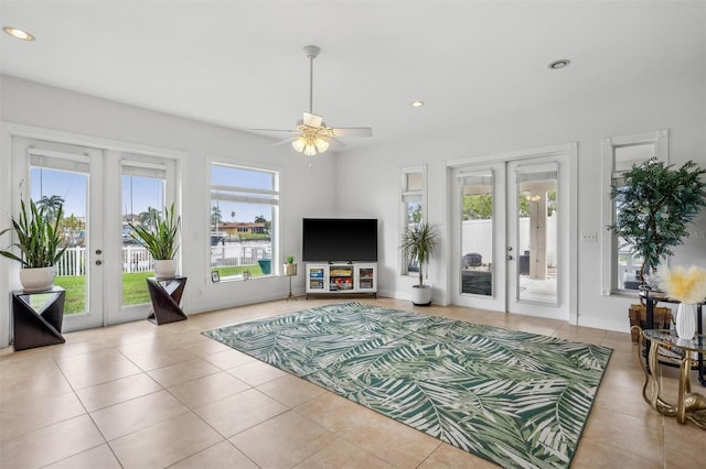 710 116th Ave, Treasure Island, FL 33706 - living area featuring french doors, tile patterned floors, a ceiling fan, and recessed lighting