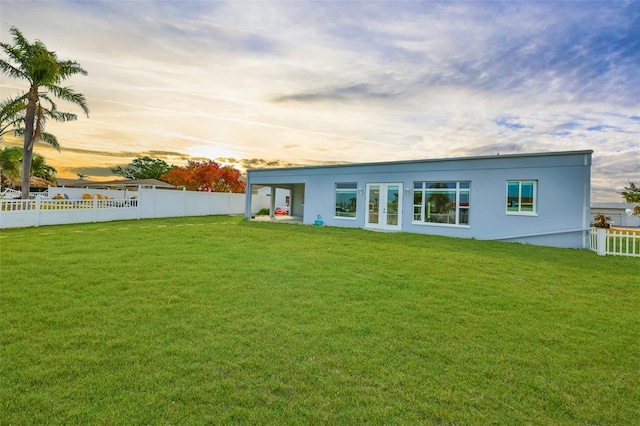 710 116th Ave, Treasure Island, FL 33706 - back of property featuring french doors and stucco siding