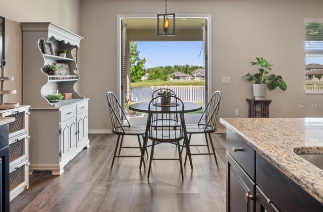 18428 Malinche Loop, Spring Hill, FL 34610 - dining area featuring wood finished floors and baseboards