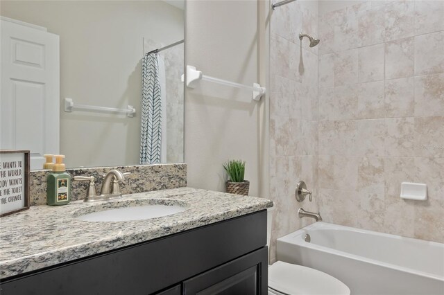 18428 Malinche Loop, Spring Hill, FL 34610 - bathroom featuring vanity, shower / bath combination with curtain, and toilet