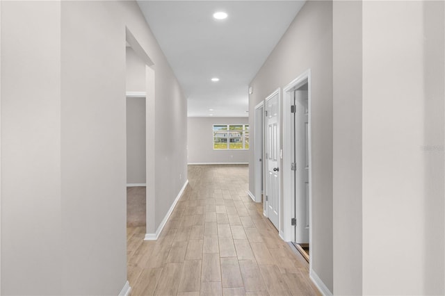 17618 Cortes Creek Blvd, Spring Hill, FL 34610 - hall with baseboards, recessed lighting, and light wood-type flooring