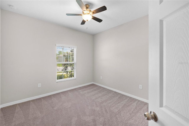 17618 Cortes Creek Blvd, Spring Hill, FL 34610 - empty room with carpet flooring, ceiling fan, a smoke detector, and baseboards
