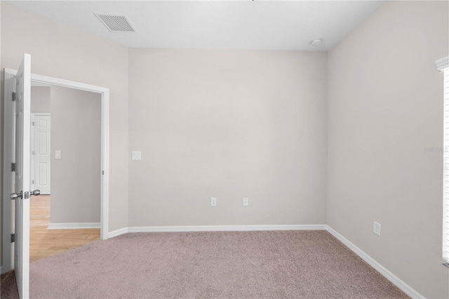17618 Cortes Creek Blvd, Spring Hill, FL 34610 - empty room with light carpet and baseboards