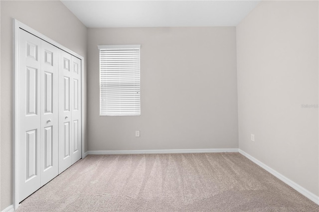 17618 Cortes Creek Blvd, Spring Hill, FL 34610 - unfurnished bedroom with carpet, baseboards, a closet, and multiple windows