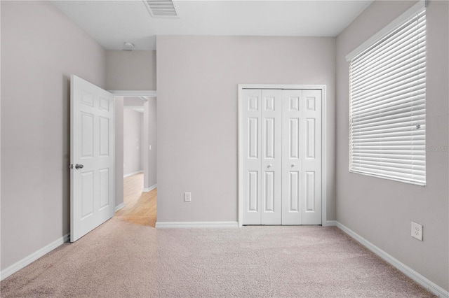 17618 Cortes Creek Blvd, Spring Hill, FL 34610 - unfurnished bedroom with carpet flooring, a closet, and baseboards