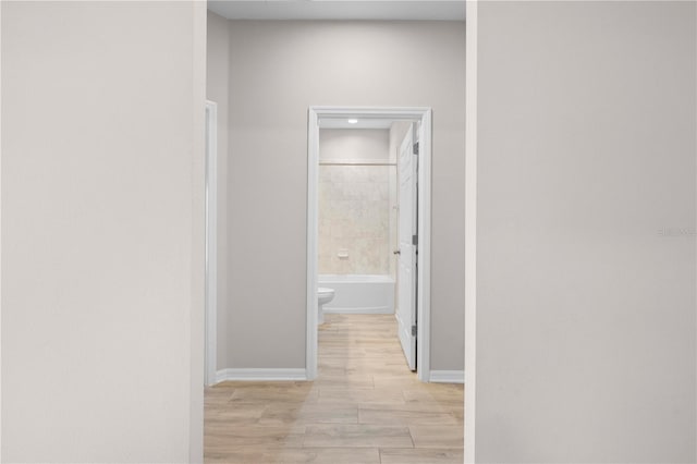 17618 Cortes Creek Blvd, Spring Hill, FL 34610 - corridor featuring baseboards and light wood finished floors