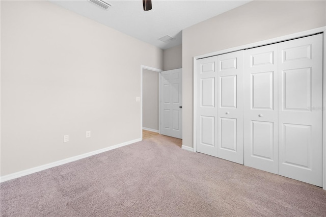 17618 Cortes Creek Blvd, Spring Hill, FL 34610 - unfurnished bedroom with carpet flooring, baseboards, a closet, and a ceiling fan