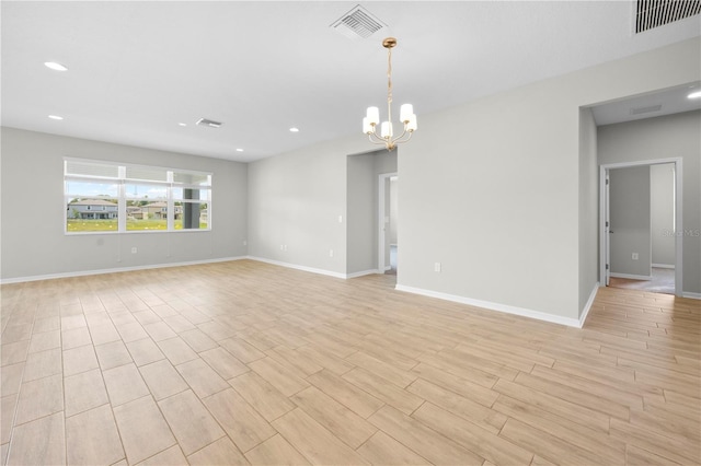 17618 Cortes Creek Blvd, Spring Hill, FL 34610 - unfurnished room with a chandelier, recessed lighting, baseboards, and light wood-style flooring