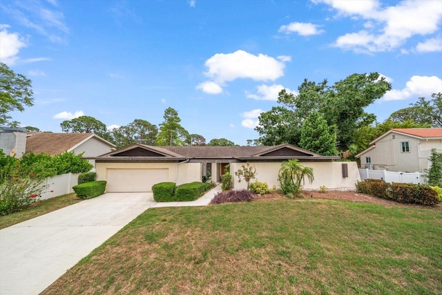 14175 Feather Sound Dr, Clearwater, FL 33762 - single story home with a garage, concrete driveway, and stucco siding