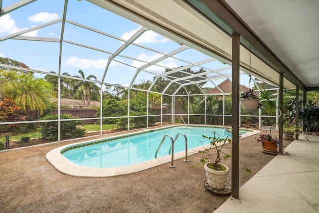 14175 Feather Sound Dr, Clearwater, FL 33762 - swimming pool featuring a fenced backyard, a patio, and glass enclosure