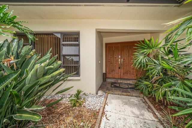 14175 Feather Sound Dr, Clearwater, FL 33762 - view of exterior entry featuring stucco siding