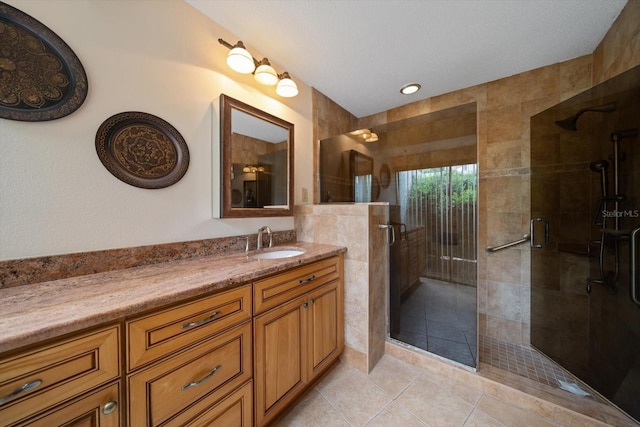 14175 Feather Sound Dr, Clearwater, FL 33762 - bathroom with vanity, a shower stall, and tile patterned flooring