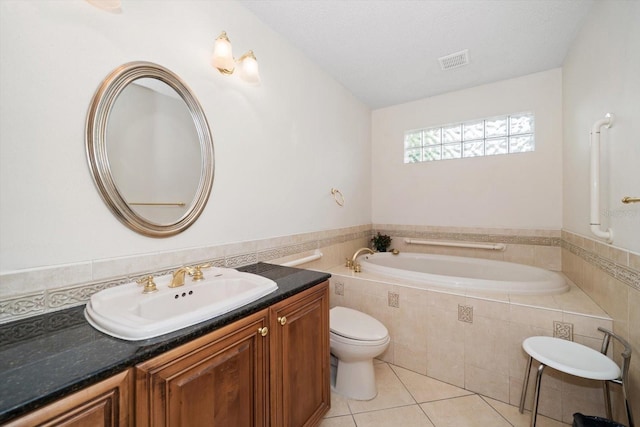 14175 Feather Sound Dr, Clearwater, FL 33762 - bathroom with toilet, tile patterned flooring, a bath, and vanity