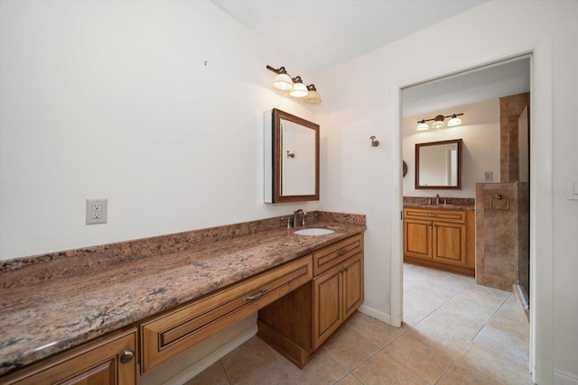 14175 Feather Sound Dr, Clearwater, FL 33762 - full bathroom featuring vanity, tile patterned floors, a shower stall, and baseboards