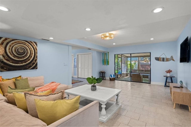 1210 Bay Pine Blvd, Indian Rocks Beach, FL 33785 - living room with light tile patterned flooring, recessed lighting, and baseboards