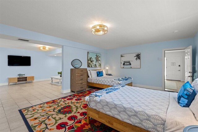 1210 Bay Pine Blvd, Indian Rocks Beach, FL 33785 - tiled bedroom featuring baseboards