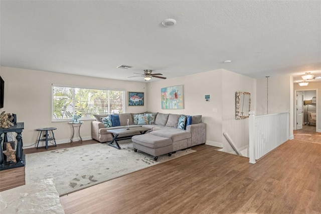 1210 Bay Pine Blvd, Indian Rocks Beach, FL 33785 - living area featuring light wood-style floors, ceiling fan, and baseboards