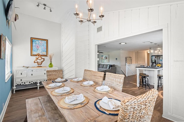 1210 Bay Pine Blvd, Indian Rocks Beach, FL 33785 - dining area featuring dark wood finished floors, a chandelier, and baseboards