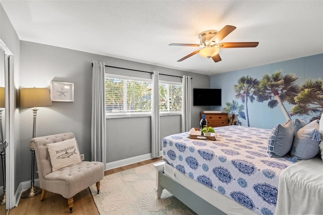 1210 Bay Pine Blvd, Indian Rocks Beach, FL 33785 - bedroom with wood finished floors, baseboards, and a ceiling fan