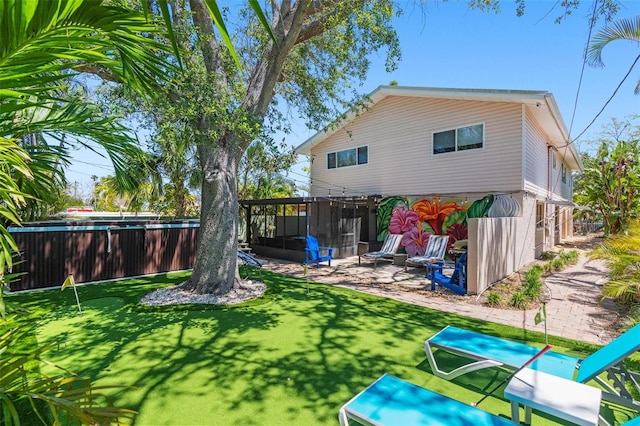 1210 Bay Pine Blvd, Indian Rocks Beach, FL 33785 - rear view of property featuring a sunroom and a patio area