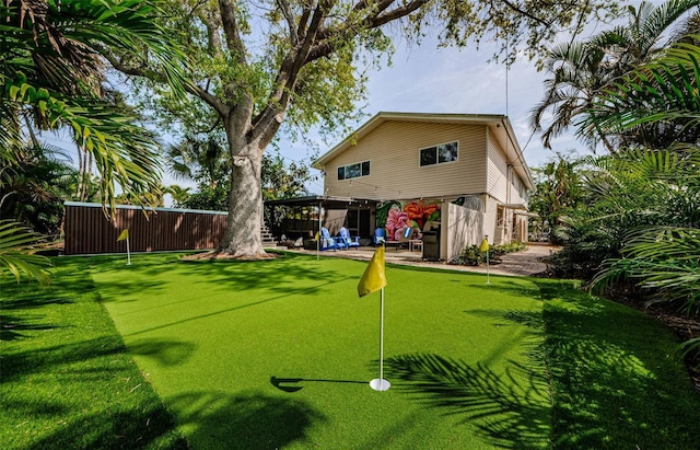1210 Bay Pine Blvd, Indian Rocks Beach, FL 33785 - rear view of property featuring a putting area