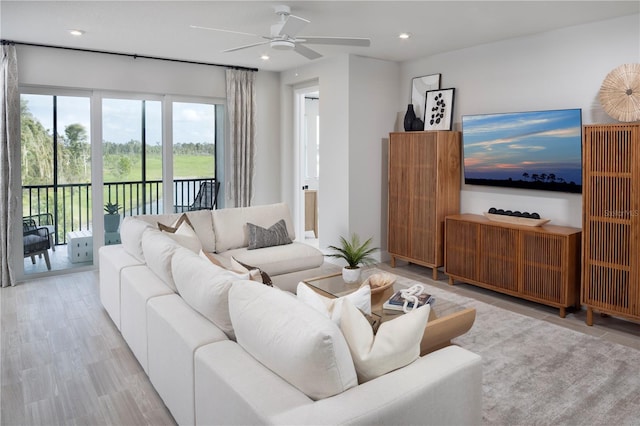 17420 Moonflower Dr Unit 201, Venice, FL 34293 - living room featuring a ceiling fan, recessed lighting, and light wood-style flooring