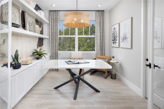 17420 Moonflower Dr Unit 201, Venice, FL 34293 - dining room with baseboards, wood tiled floors, and recessed lighting