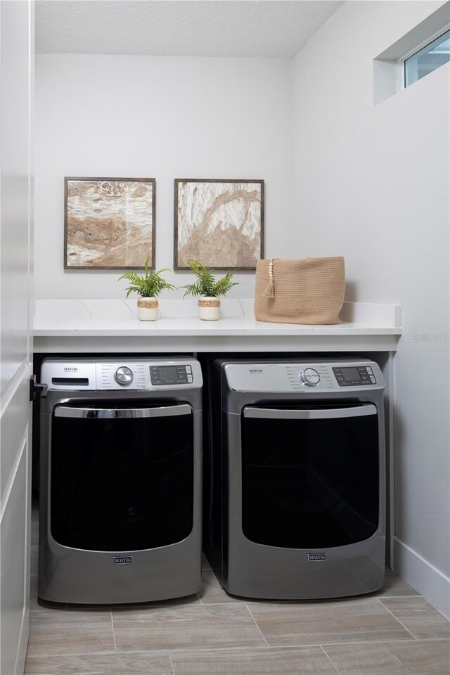 17420 Moonflower Dr Unit 201, Venice, FL 34293 - washroom featuring independent washer and dryer