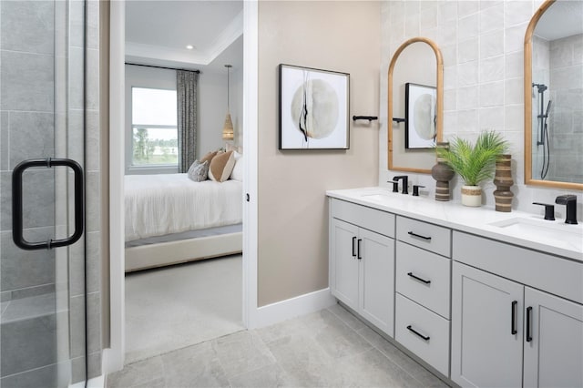 17420 Moonflower Dr Unit 201, Venice, FL 34293 - full bath with ensuite bath, a shower stall, ornamental molding, baseboards, and double vanity