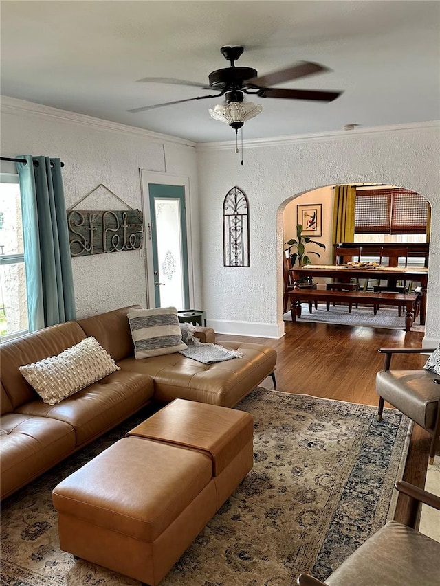 1020 38th Ave N, Saint Petersburg, FL 33704 - living area featuring arched walkways, a textured wall, crown molding, wood finished floors, and a ceiling fan
