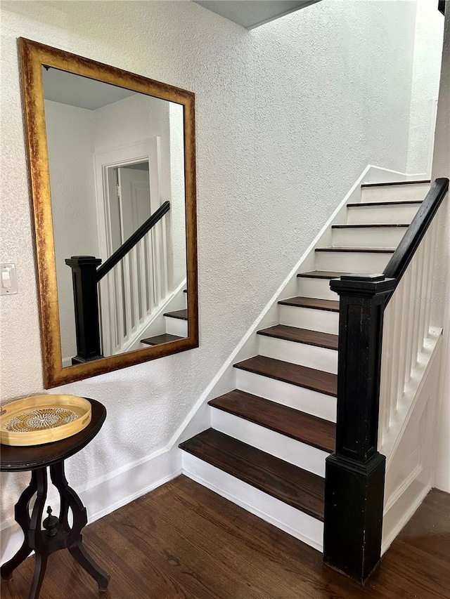 1020 38th Ave N, Saint Petersburg, FL 33704 - stairs featuring a textured wall, wood finished floors, and baseboards