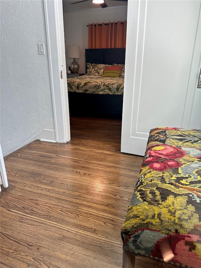 1020 38th Ave N, Saint Petersburg, FL 33704 - bedroom with dark wood finished floors, a textured wall, and baseboards